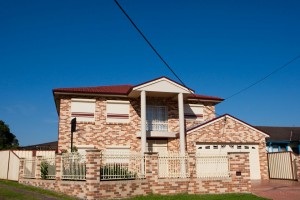 double storey brick home with blockout roller shutters